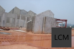 Lightweight cellular concrete wall panels staged for erection